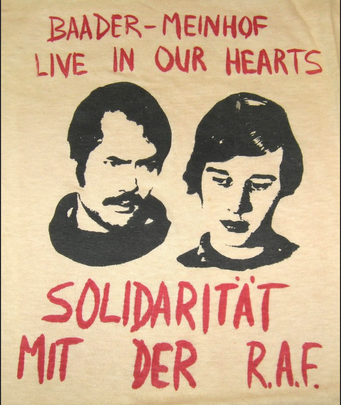 Depicting the faces of Andreas Baader and Ulrike Meinhof, this T-shirt shows support for the Red Army Faction (RAF), or Baader-Meinhof Gang – a militant leftwing terror group formed in 1970, West Germany; they fought for communism, anti-imperialism, and used violent means to promote their political goals and beliefs. Translated from German, the bottom portion of the shirt states: “Solidarity with the R.A.F.”